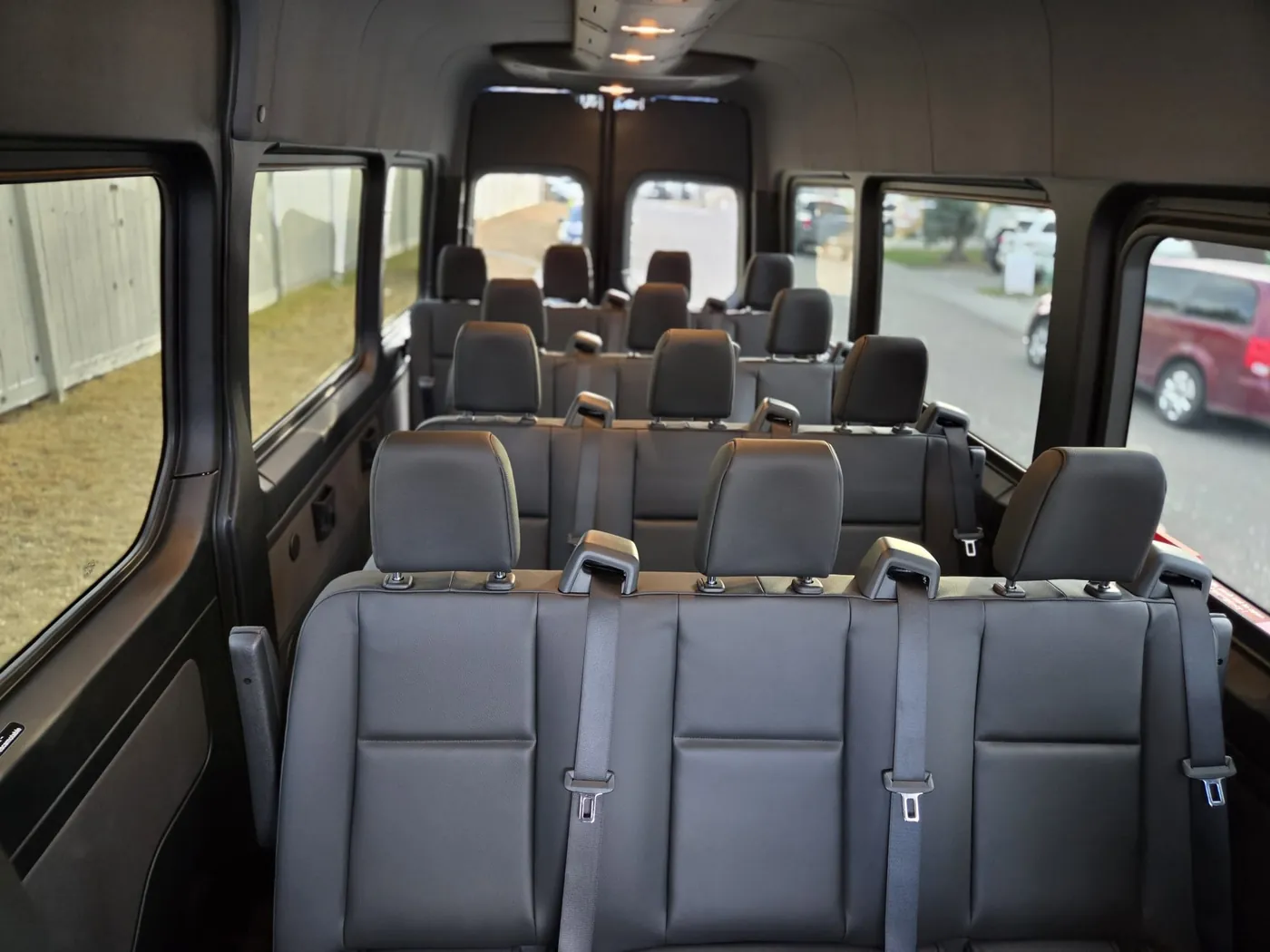 Interior seating of the 14-passenger Mercedes Sprinter charter van in Calgary